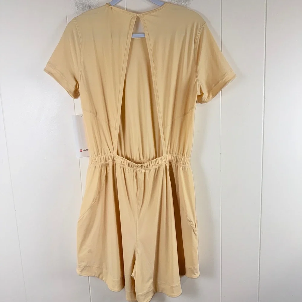 Lululemon Lightweight High Neck Romper Size 6 Tan Short Sleeve Open Back Pockets